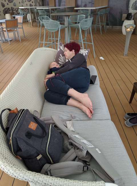 Ashley Schwaratu and baby asleep on cruise deck