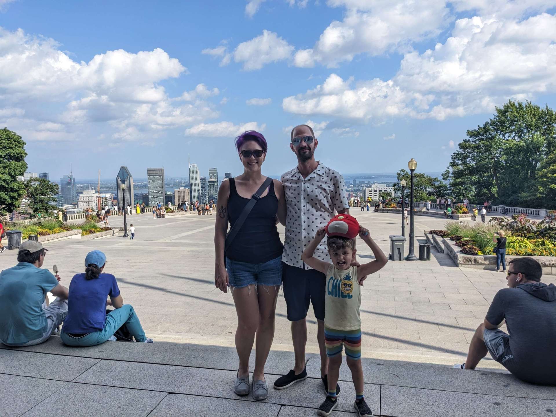Ashley Schwartau, Justin Bonnema, and child standing at the top of Mont Royal in Montreal