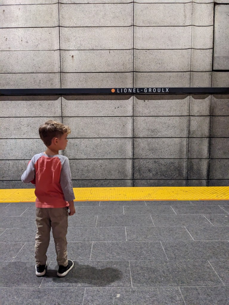 Skyler waiting for the train at the Lionel-Groulx metro in Montreal, Quebec, Canada