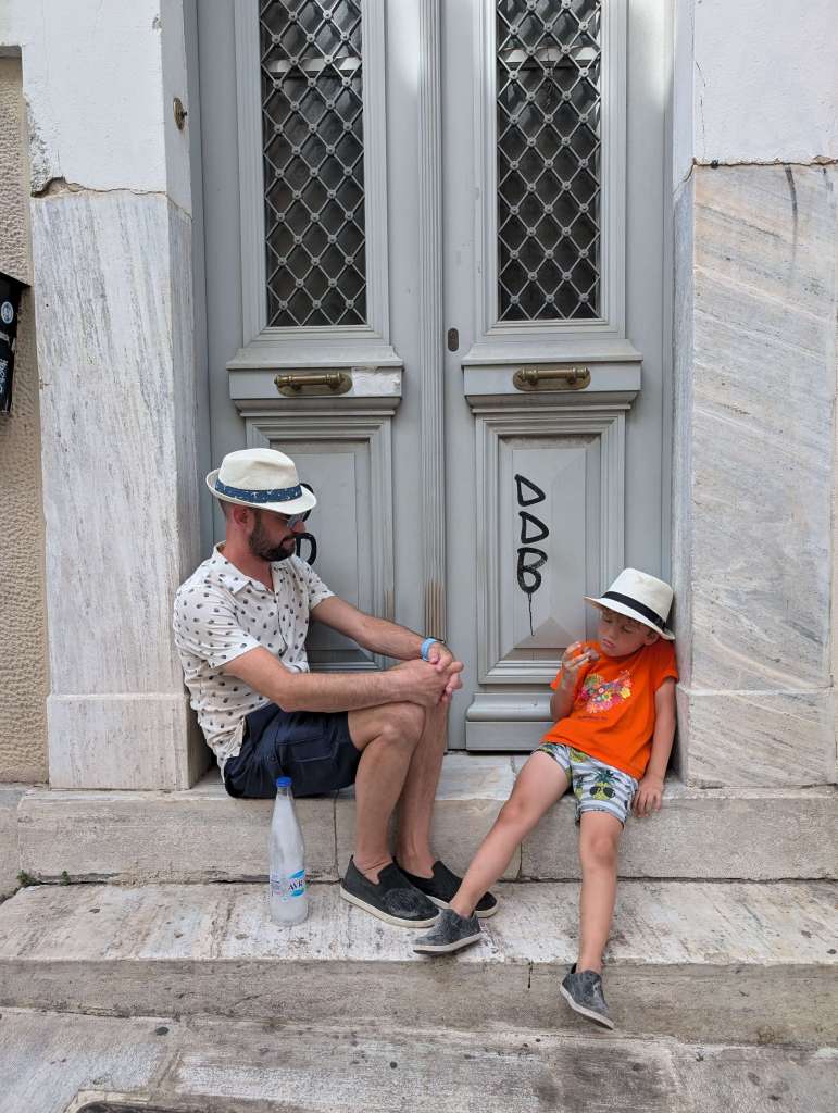 The realities of traveling with our kid: many many breaks during our long walks