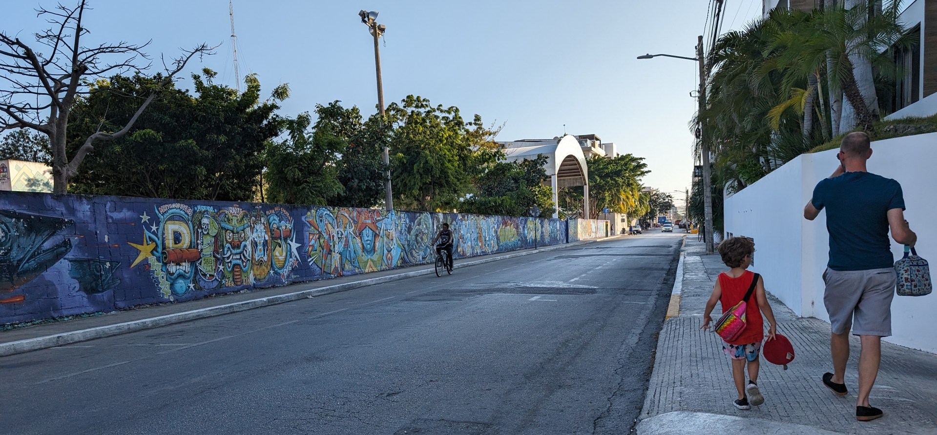 Slow travel in action: The boys, walking to playground before we walk to dinner, in PDC