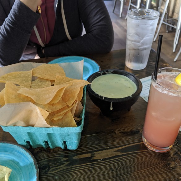 YUM Nectar chips and queso, and a paloma