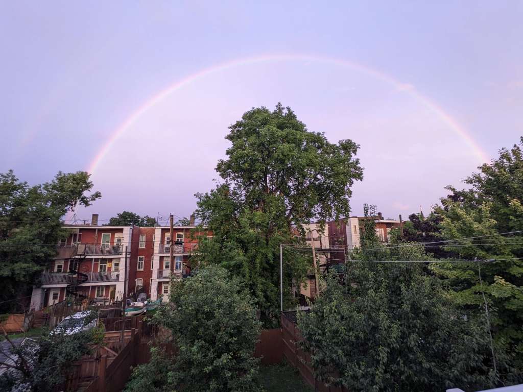 A rainbow over the plex apartments in Verdun Montreal